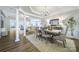 Elegant dining room with coffered ceiling, hardwood floors, and views into living spaces at 7123 Meyer Rd, Fort Mill, SC 29715