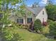 Charming, one-story home with manicured landscaping and inviting curb appeal under a blue sky at 7123 Meyer Rd, Fort Mill, SC 29715