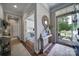 Inviting foyer featuring hardwood floors and a decorative console table with mirror at 7123 Meyer Rd, Fort Mill, SC 29715