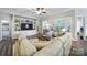 Inviting living room with built-in shelving, large windows, and comfortable seating at 7123 Meyer Rd, Fort Mill, SC 29715