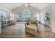 Bright and airy living room with large windows, a comfortable chaise lounge, and stylish decor at 7123 Meyer Rd, Fort Mill, SC 29715