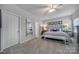 Cozy bedroom featuring a comfortable bed, soft carpet, ceiling fan, and plenty of natural light at 7123 Meyer Rd, Fort Mill, SC 29715