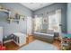 Bright bedroom with neutral walls, windows, and hardwood floors at 7417 Chidley Dr, Charlotte, NC 28269