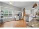 Spacious kitchen with stainless steel appliances, white cabinets, and hardwood floors at 7417 Chidley Dr, Charlotte, NC 28269