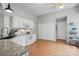 Well-lit kitchen with white cabinetry, stainless appliances, and a door to the outside at 7417 Chidley Dr, Charlotte, NC 28269