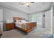 Calm main bedroom with tray ceiling, carpet, and natural light at 7417 Chidley Dr, Charlotte, NC 28269
