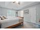 Tranquil main bedroom with tray ceiling, soft carpet, and abundant natural light at 7417 Chidley Dr, Charlotte, NC 28269