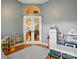 Bright playroom with neutral walls, hardwood floors, and french doors at 7417 Chidley Dr, Charlotte, NC 28269