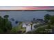 Breathtaking aerial view of a luxurious waterfront estate with private docks at 7679 Rabbit Cir, Denver, NC 28037