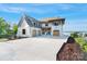Stunning two-story home with a grand driveway and elegant architectural details at 7679 Rabbit Cir, Denver, NC 28037