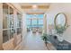 Inviting foyer with hardwood floors, elegant lighting, and scenic waterfront views at 7679 Rabbit Cir, Denver, NC 28037
