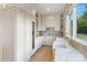 Charming butler's pantry features custom cabinets, stone accents, and ample counter space at 7679 Rabbit Cir, Denver, NC 28037