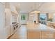 Modern kitchen featuring a large island, high-end appliances, and custom cabinetry at 7679 Rabbit Cir, Denver, NC 28037