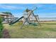 Lakeside playground with slide, swings, and climbing frame offering endless fun for with stunning views at 7679 Rabbit Cir, Denver, NC 28037
