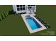 A custom in-ground pool with a spill-over spa, surrounded by vibrant landscaping, completes this backyard oasis at 7679 Rabbit Cir, Denver, NC 28037
