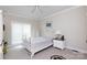 Bedroom features neutral carpet, a ceiling fan and a large window for ample natural light at 777 Sanside Dr, York, SC 29745