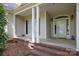 Inviting front porch with brick accents and classic white columns at 777 Sanside Dr, York, SC 29745