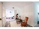 Hallway with two rocking chairs, leads to the bonus room and other areas of the house at 777 Sanside Dr, York, SC 29745