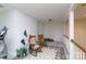 Hallway features a coat rack, an exercise machine, two rocking chairs and access to other rooms at 777 Sanside Dr, York, SC 29745