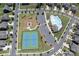 Aerial view of community pool, tennis courts, playground, and parking area at 8000 Millbridge Pkwy, Waxhaw, NC 28173
