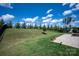Well-maintained backyard featuring a patio, fire pit, and grassy area at 8000 Millbridge Pkwy, Waxhaw, NC 28173
