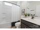 Stylish bathroom with a framed mirror, modern vanity, and a shower-tub combination at 8000 Millbridge Pkwy, Waxhaw, NC 28173