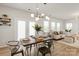 Open-concept dining and living area with lots of natural light at 8000 Millbridge Pkwy, Waxhaw, NC 28173
