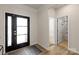 Bright entryway featuring a modern front door, neutral walls, and durable floors at 8000 Millbridge Pkwy, Waxhaw, NC 28173