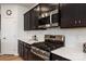 Modern kitchen features stainless steel appliances, sleek cabinets, and stylish countertops at 8000 Millbridge Pkwy, Waxhaw, NC 28173