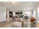 Expansive living space featuring an open-concept design, seamlessly blending the kitchen, dining, and living areas at 8000 Millbridge Pkwy, Waxhaw, NC 28173