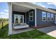 Charming porch with a relaxing swing, perfect for enjoying the outdoors at 8000 Millbridge Pkwy, Waxhaw, NC 28173