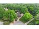 Stunning aerial view of the property showcasing the house, pool, and mature trees at 8214 Coristar Pl, Huntersville, NC 28078
