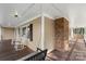 Covered front porch boasts traditional wood flooring, rocking chairs, porch swing, and neutral color scheme at 8214 Coristar Pl, Huntersville, NC 28078