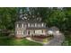 Charming two-story home with a welcoming porch and beautifully landscaped front yard at 8214 Coristar Pl, Huntersville, NC 28078