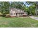 Well maintained home with mature lawn, manicured landscaping and covered front porch at 8214 Coristar Pl, Huntersville, NC 28078