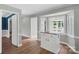 Open living room with hardwood floors, kitchen island and views to the outside at 8214 Coristar Pl, Huntersville, NC 28078