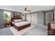 Inviting main bedroom with a ceiling fan, closet space, and natural lighting from multiple windows at 8214 Coristar Pl, Huntersville, NC 28078