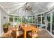 Virtually Staged Sunroom with floor to ceiling windows at 8214 Coristar Pl, Huntersville, NC 28078