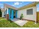 Charming back patio area with blue curtains, a small fountain, and meticulously maintained landscaping at 8726 Castle Cliff Dr, Matthews, NC 28105