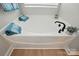 Bright white corner bathtub with black fixtures and natural light, perfect for relaxation at 8726 Castle Cliff Dr, Matthews, NC 28105