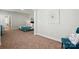 Open bedroom view with carpeted floors and large comfortable bed with teal bedding at 8726 Castle Cliff Dr, Matthews, NC 28105