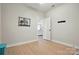 Versatile flex room with wood floors, doorway, and neutral paint, perfect for customization at 8726 Castle Cliff Dr, Matthews, NC 28105