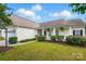 Charming one-story home with well-manicured lawn, inviting front porch and neutral siding at 8726 Castle Cliff Dr, Matthews, NC 28105