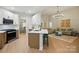 Open-concept kitchen with stainless steel appliances, white cabinets, and seamless connection to the living room at 8726 Castle Cliff Dr, Matthews, NC 28105