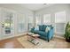 Comfortable living room with a blue couch, plenty of natural light, and an inviting atmosphere at 8726 Castle Cliff Dr, Matthews, NC 28105