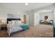 Bright main bedroom featuring neutral tones, carpeted floors, and comfortable furnishings at 8726 Castle Cliff Dr, Matthews, NC 28105
