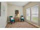 Cozy sitting room with natural light from two windows, features modern furniture and stylish decor at 8726 Castle Cliff Dr, Matthews, NC 28105