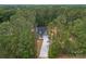 Aerial view of home with long driveway surrounded by lush green trees at 925 Twin Lakes Rd, Rock Hill, SC 29732