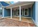 Covered back porch with white columns and trim overlooking the yard, attached to home with light blue siding at 925 Twin Lakes Rd, Rock Hill, SC 29732