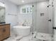 Serene bathroom featuring a soaking tub, glass-enclosed shower, and tasteful finishes for a relaxing retreat at 925 Twin Lakes Rd, Rock Hill, SC 29732